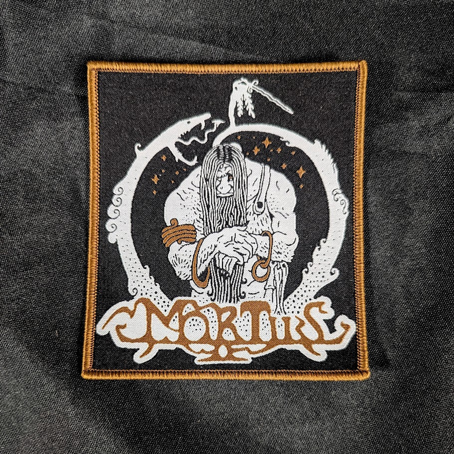 Woven patch, black background, white and copper detail