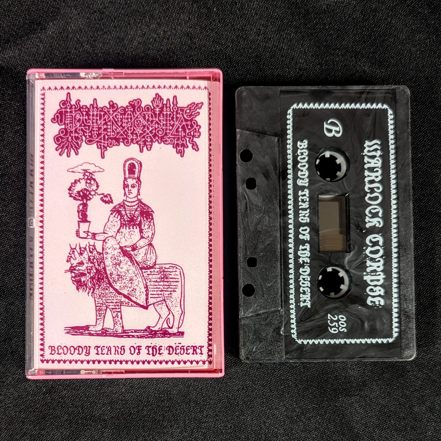 WARLOCK CORPSE "Bloody Tears of the Desert" cassette tape, black shell with white ink, with norelco case and printed j-card