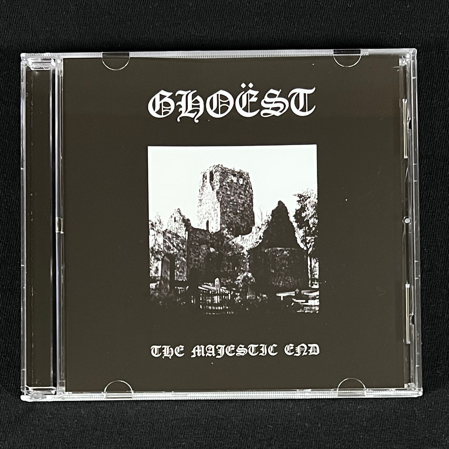 CD case with 'GHOEST' and 'The Majestic End' text on a black background