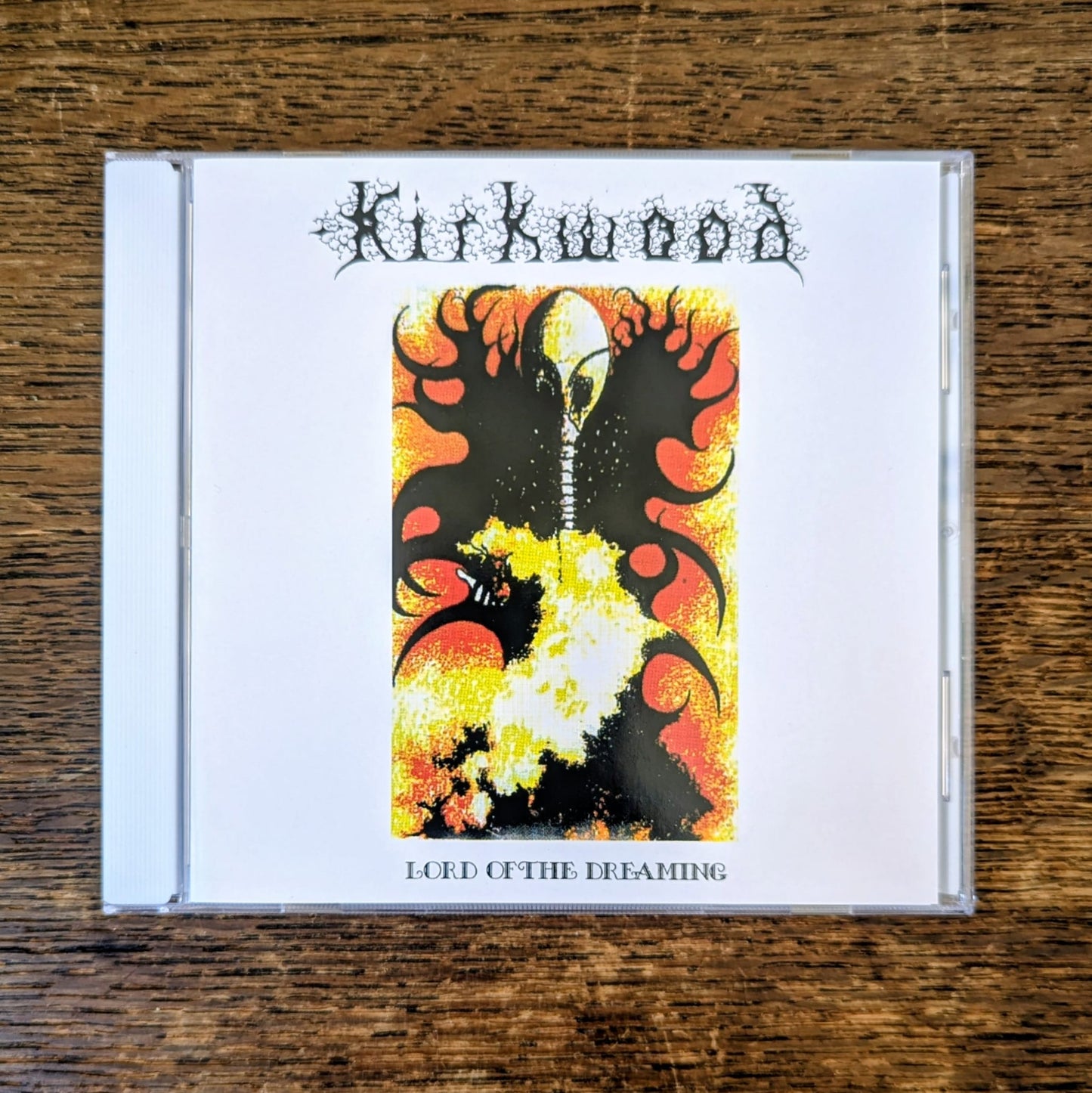 CD cover with 'Kirkwood' and 'Lord of the Dreaming' on a wooden surface
