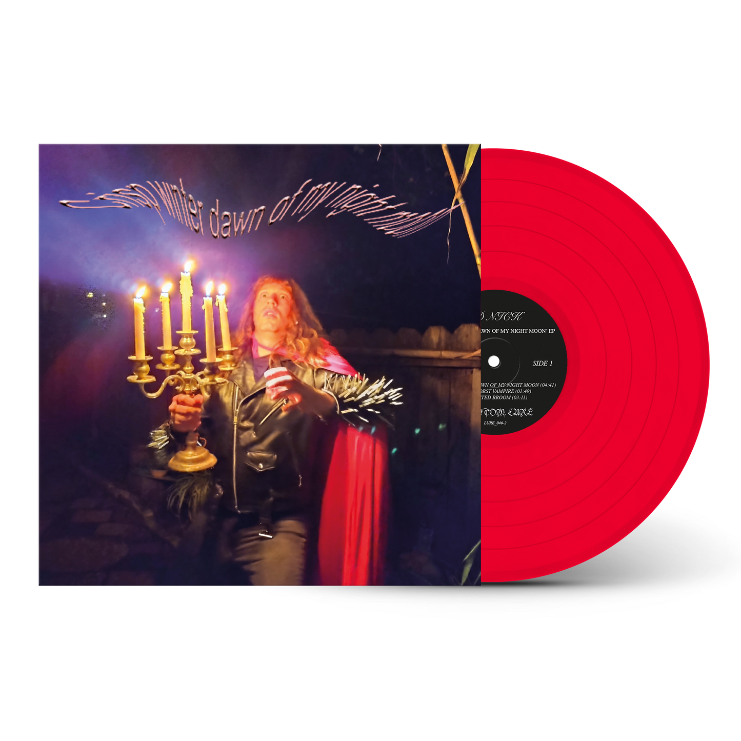 Vinyl record with a red disc and album cover featuring a person with candles.