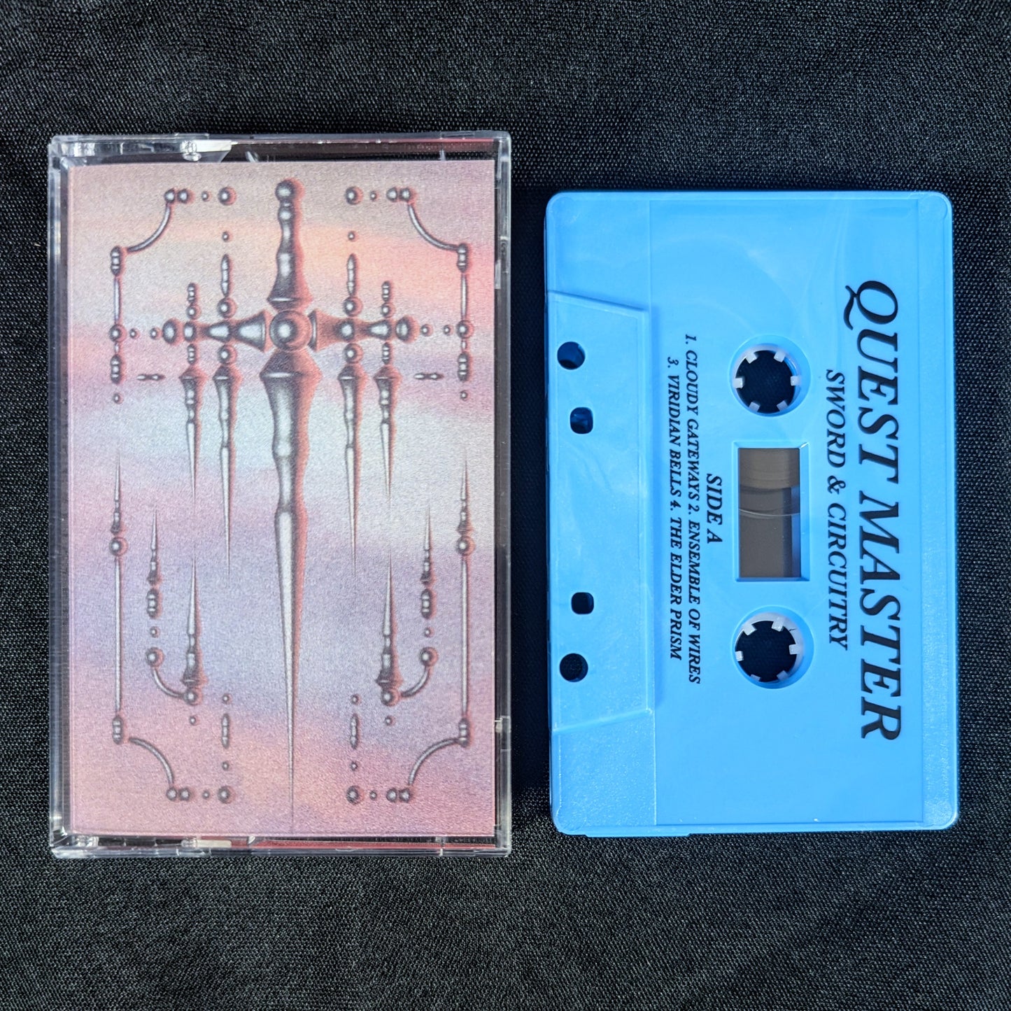 QUEST MASTER "Sword & Circuitry" cassette tape (repress, lim.200)