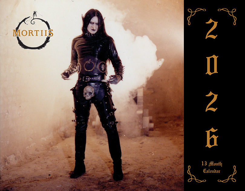 Person in dark, stylish clothing with 'Mortiis' branding and '2026' on a textured background.