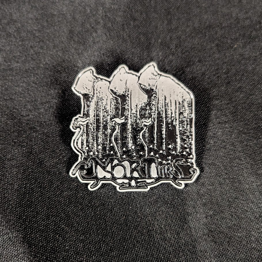 Metal enamel pin, silver metal with black detail.