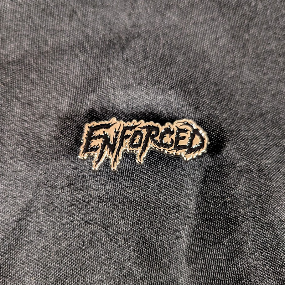 Metal enamel pin, silver metal with black detail.