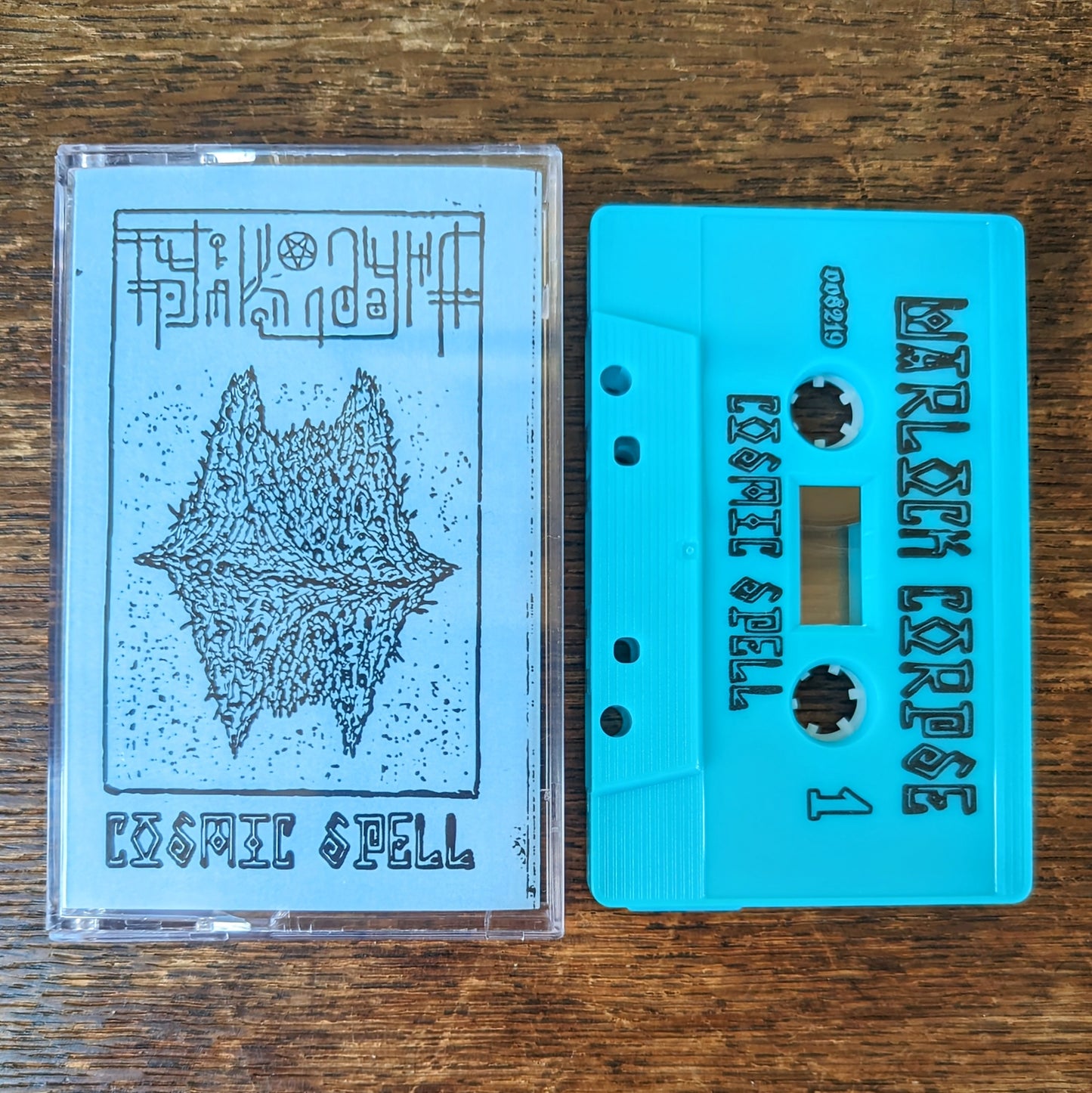 WARLOCK CORPSE "Cosmic Spell" Cassette Tape [lim.200, 2 color options] (Труп Колдуна)