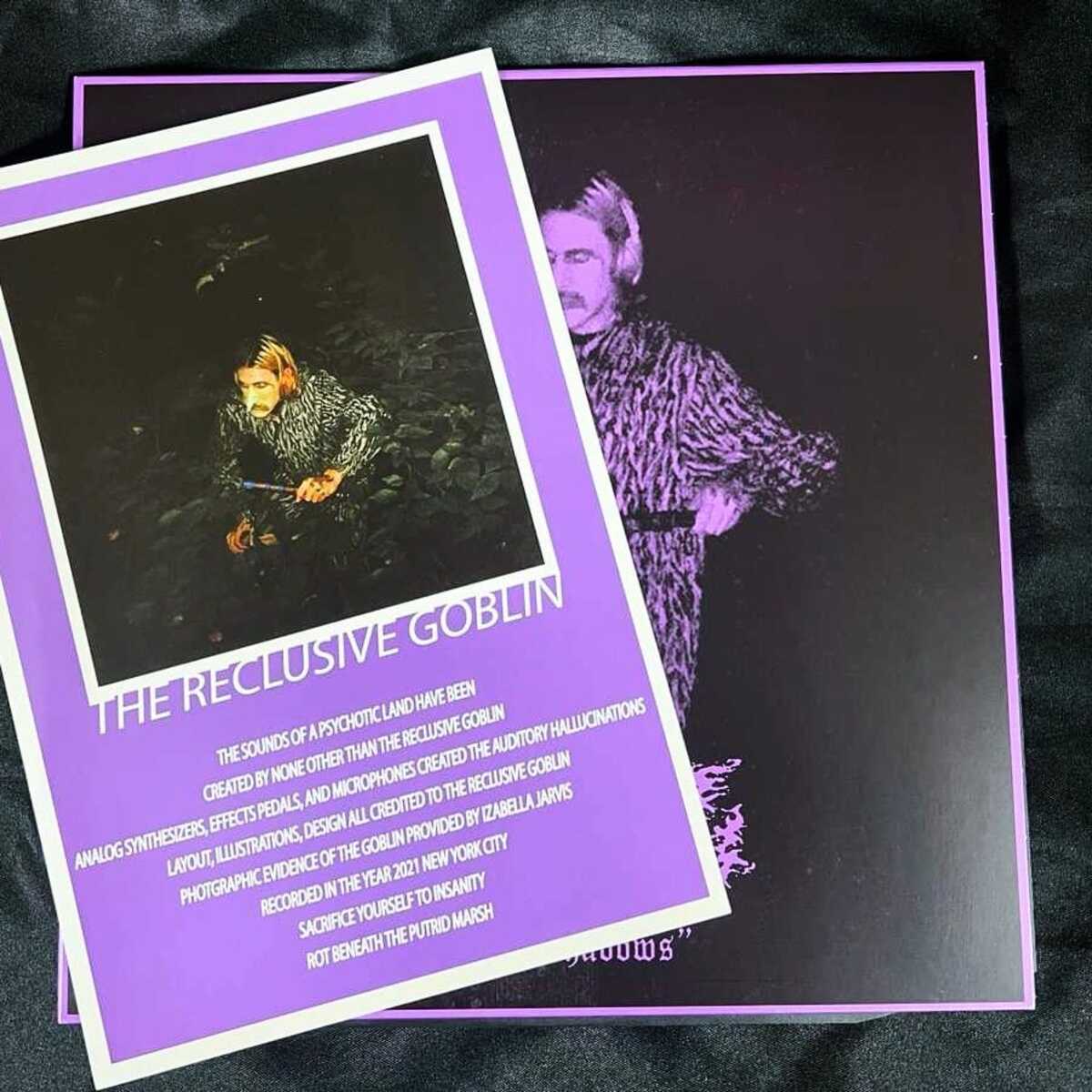 Two cards with artistic illustrations and text on a dark background