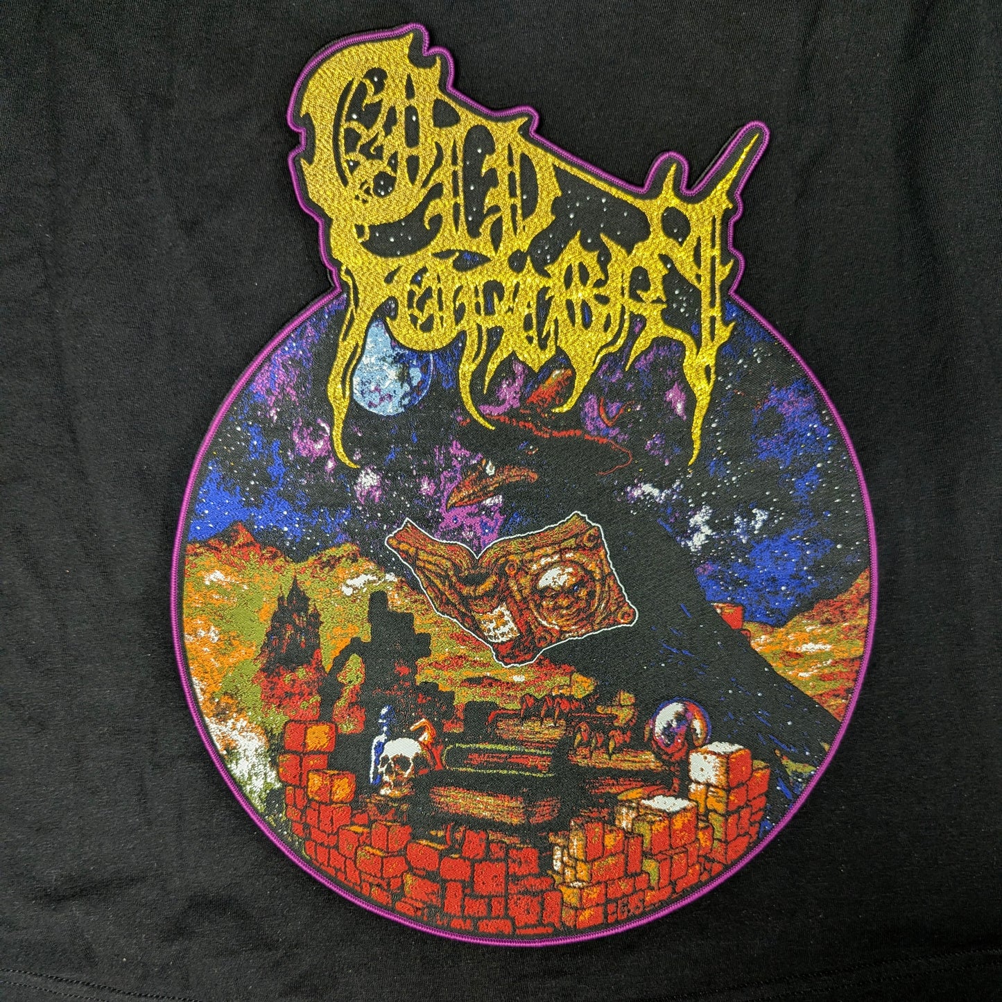 Colorful graphic design on a black background with text and landscape elements.