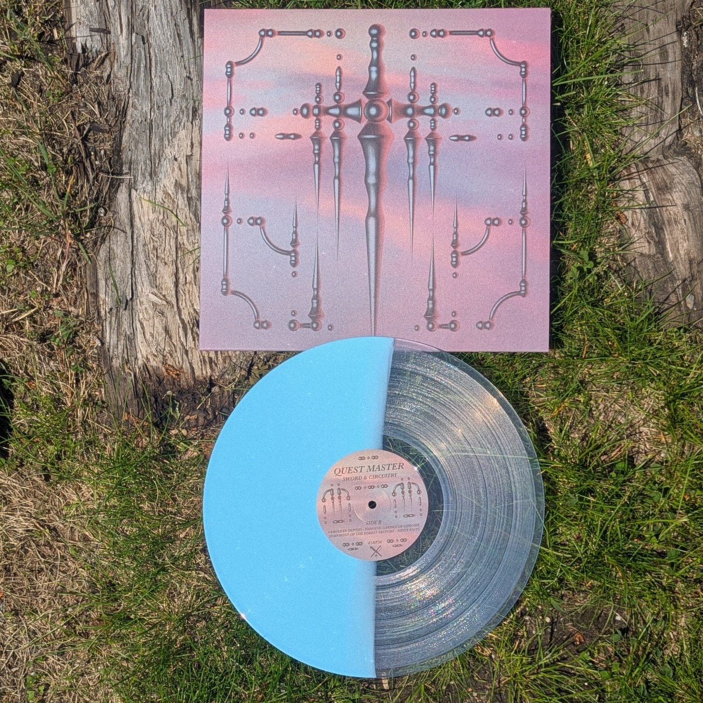Vinyl record with a colorful cover on grass