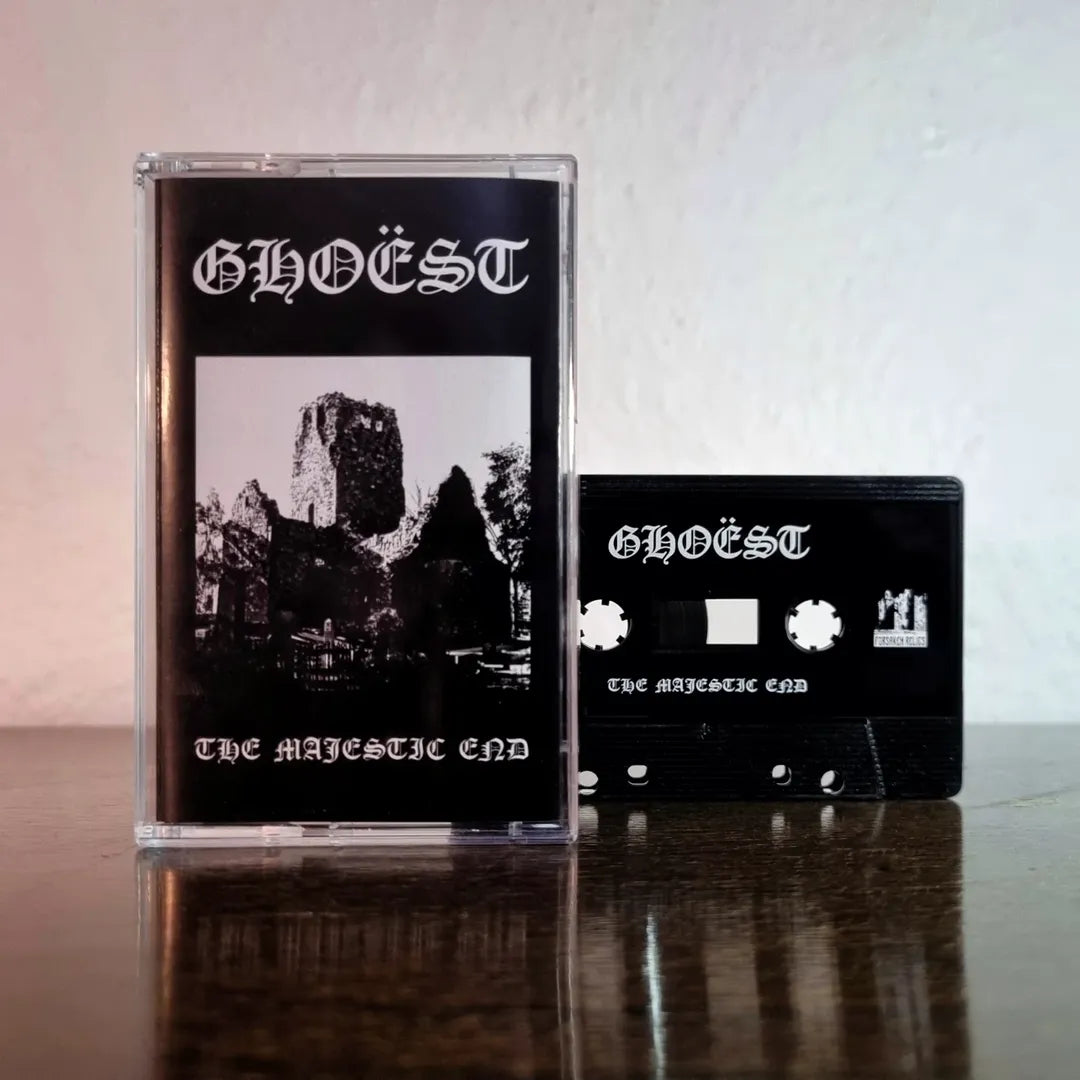 Two cassette tapes with 'GHOEST' branding on a reflective surface.