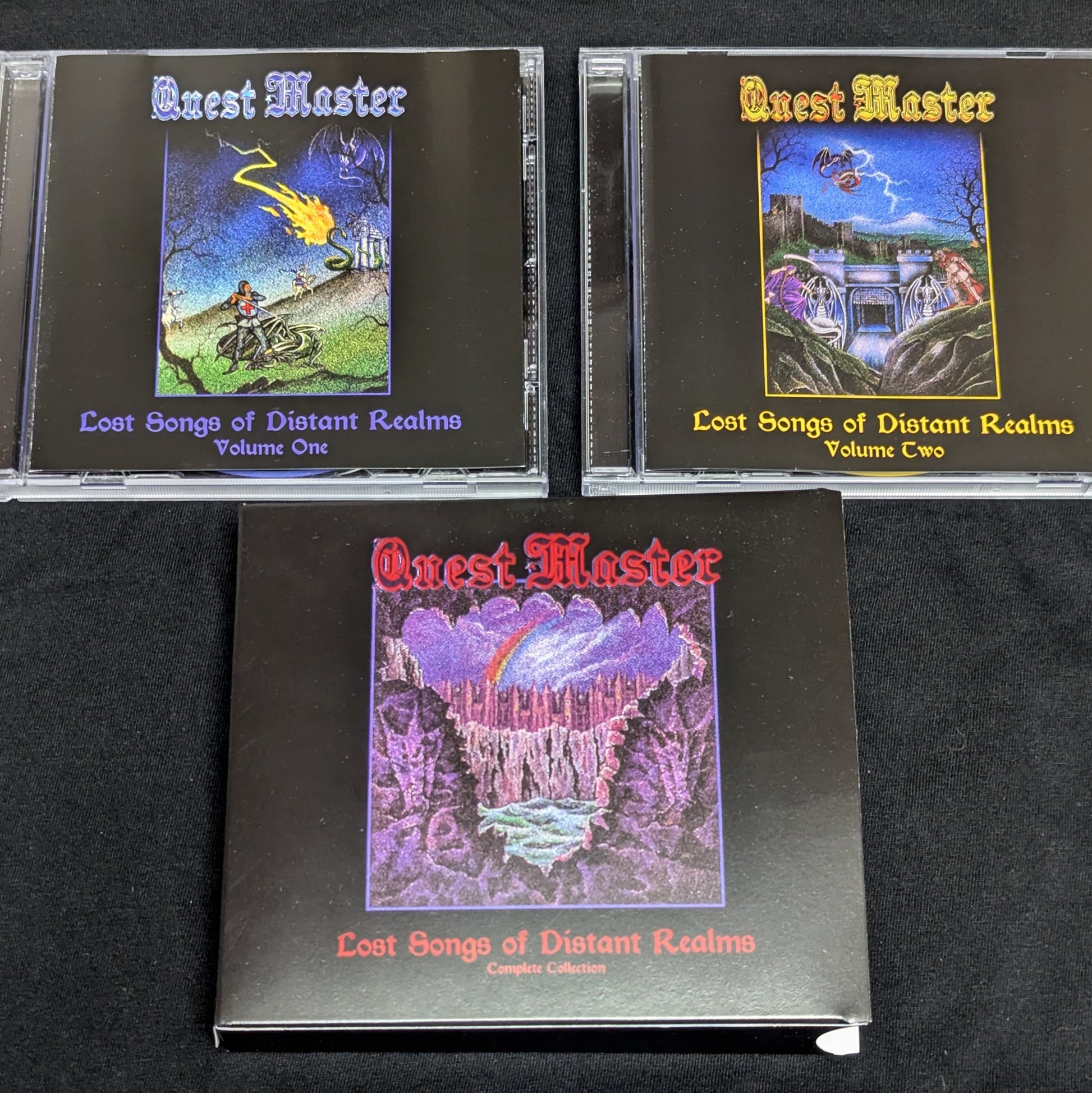 'Quest Master' music albums on a black surface