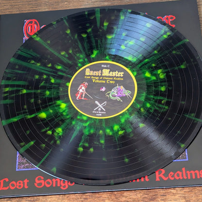 Vinyl record with a green and black design on a wooden surface