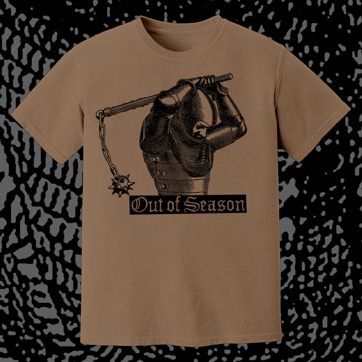 Brown t-shirt with a graphic design and 'Out of Season' text on a patterned background